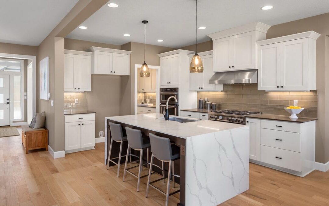 Kitchen island with a veined white top, a common look among kitchen countertop materials