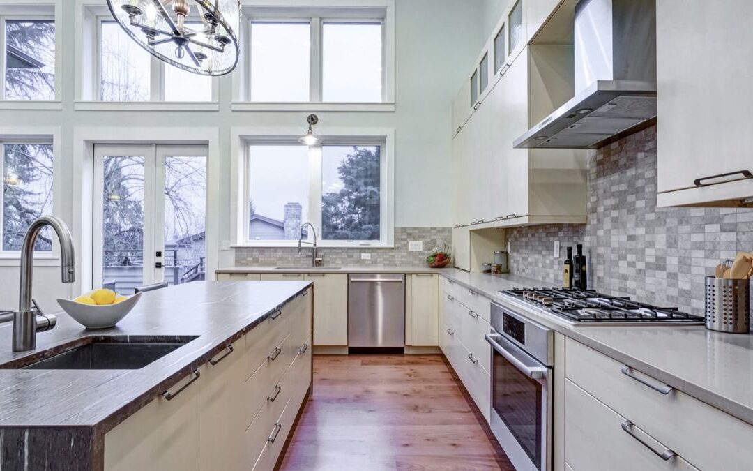 Kitchen with a sink under a window and a range nearby, an example of kitchen workflow design in action