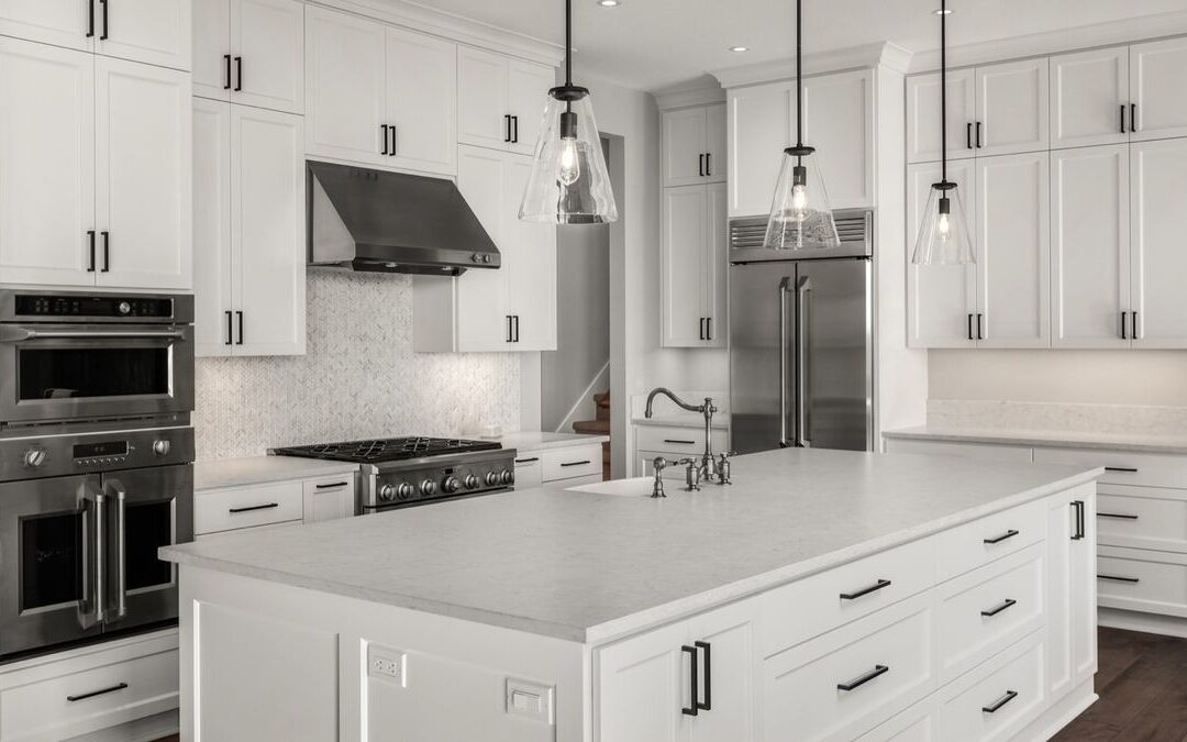 White kitchen with tall cabinets and an island, a scope that shapes a Sacramento kitchen remodel cost