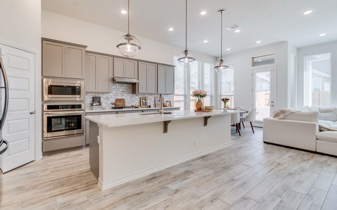 Remodeled kitchen open to a living room, a scope that often involves Sacramento remodeling permits